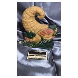 Cast iron horn of plenty doorstop