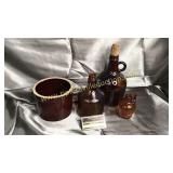 Amber jugs and crock jar