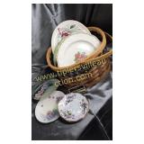 Basket of handpainted plates and other dishes