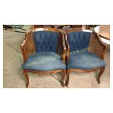 Cane sided upholstered club chairs sold 2x the