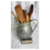 Wooden spoons in aluminum pitcher