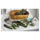 Green wooden handle utensils in garden basket