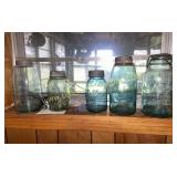 Shelf with blue fruit jars