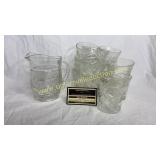 Starburst cream pitcher and 12 small glasses