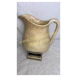 Old ironstone pitcher has been repaired