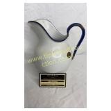 White and blue enamel ware pitcher