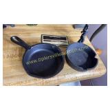 2 cast iron ashtrays