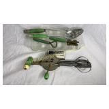 Green handle utensils and glass corn stick pan