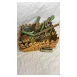 Wooden green handle kitchen utensils in basket