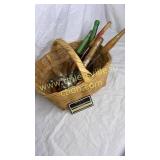 Basket of old wood handle kitchen utensils