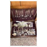 Box of vintage flatware and serving pieces
