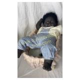 Little boy baby in doll cradle missing an eye