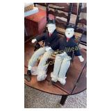 Laurel and Hardy porcelain dolls on park bench