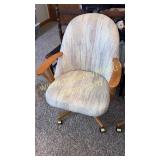 Upholstered rolling office swivel chair