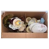 Box with dishes, glass and decor