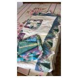 Store bought quilt and retro sheet set