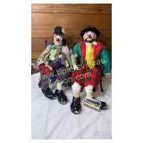 2 hobo clown porcelain dolls on bench- one has