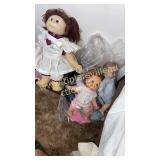 Doll chair and group of baby dolls