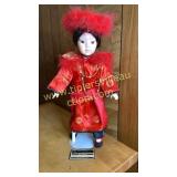 Porcelain emperor doll