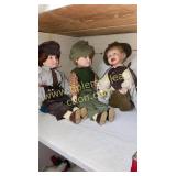 Pair of school boy porcelain dolls and Sherlock