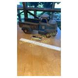 Antique pressed tin buckeye toy truck