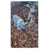 Concrete pig and statue