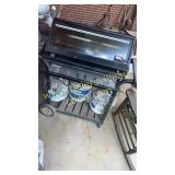 Charbroil grill and 3 tanks