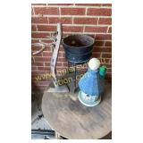 Cast iron pot on stand, birdhouse and rack