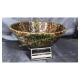 Old majolica spongeware mixing bowl has crack