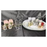 9 vintage salt and pepper shakers on ivy platter