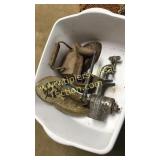 Group of sad irons, trivet, grinder