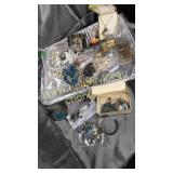 Tin of costume jewelry turquoise and others