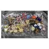 Glass tray with brooches and ear bobs