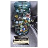 Blue glass lid jar with marbles