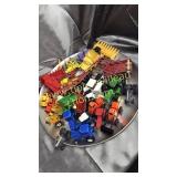 Collection of toy tractors and implements on