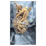 Pitcher full of old wooden clothespins