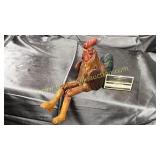 Wood carved sitting rooster