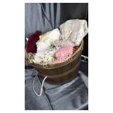 Large garden basket full of doilies and crochet