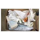 Box of linens and Afghan