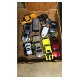 Box of die case cars, John Deere trucks and