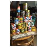 Collection of oil cans some with oil and widen