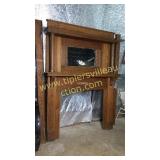 Antique solid oak mantle with beveled mirror with