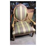 Large upholstered carved arm chair