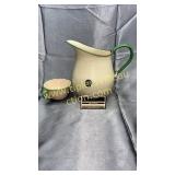 Tan and green enamel ware pitcher and cup