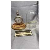 Pocket watch in display globe