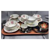 7 cups and saucers some bone China one occupied