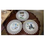 Hand painted milk glass bird and flower plates