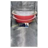2 pink Pyrex dishes one with lid