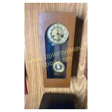 Antique wall clock with ornate face & pendulum