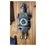 Antique wall clock with heavy brass detail